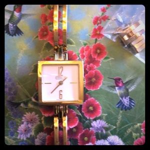 Ladies vintage gold tone coach bracelet watch